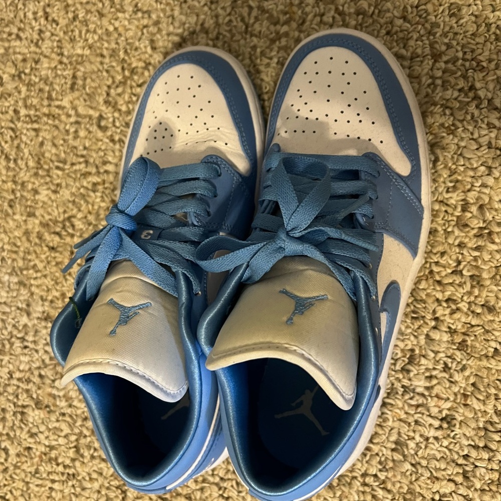 White and blue air Jordan’s shoes